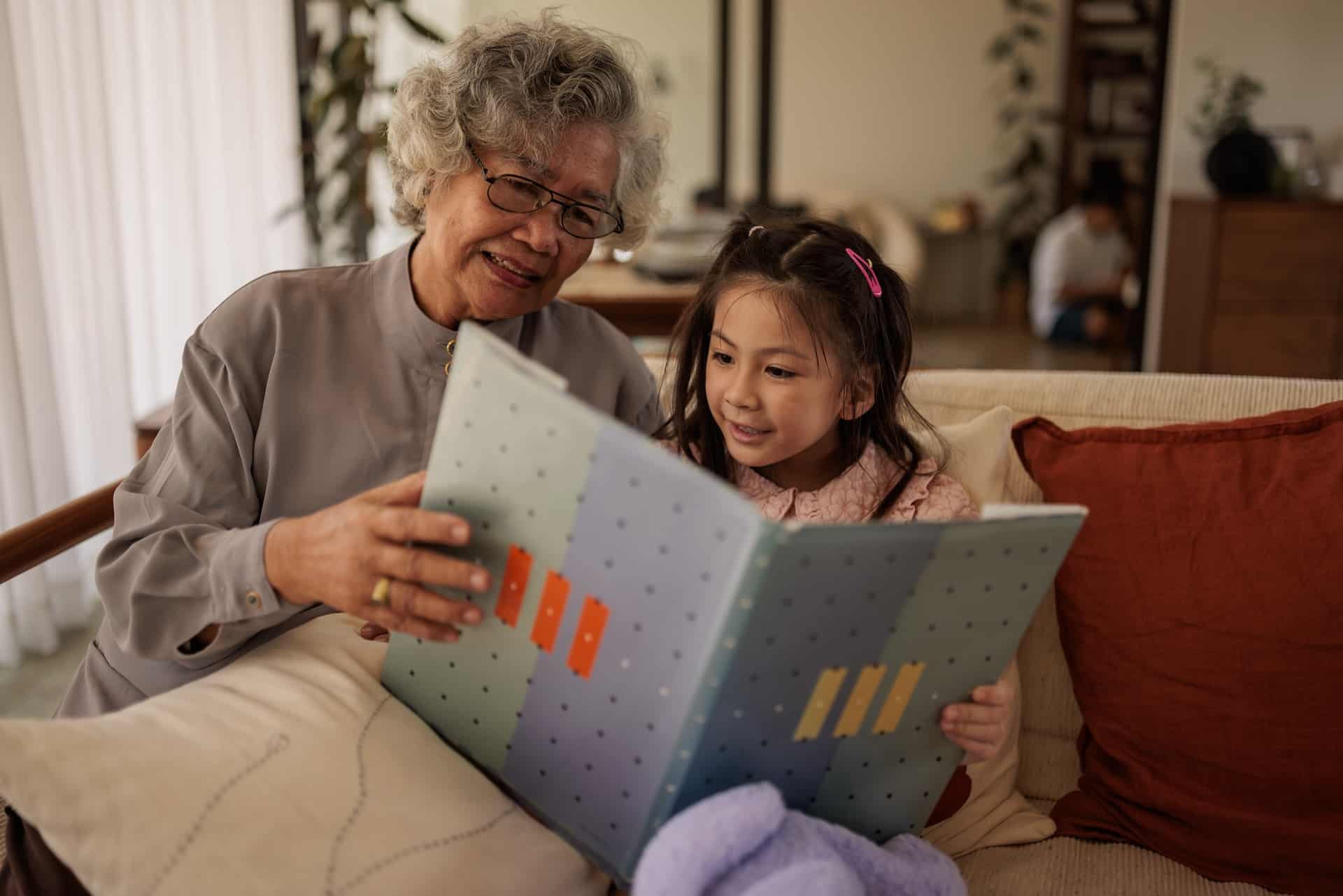 Girl reading with grandma